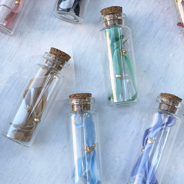 Pulsera estrella en bote de cristal